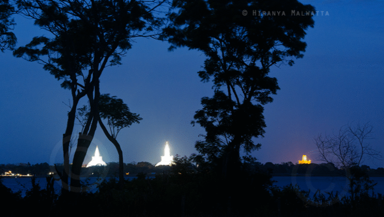 View of Three Dagoba (Sthupa) over Nuwara Wewa Anuradhapura Sri Lanka by Hiranya Malwatta