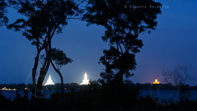 View of Three Dagoba (Sthupa) over Nuwara Wewa Anuradhapura Sri Lanka by Hiranya Malwatta